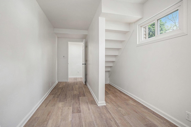 329 N Liberty St, Marshall, MI 49068 - hallway with wood finished floors and baseboards
