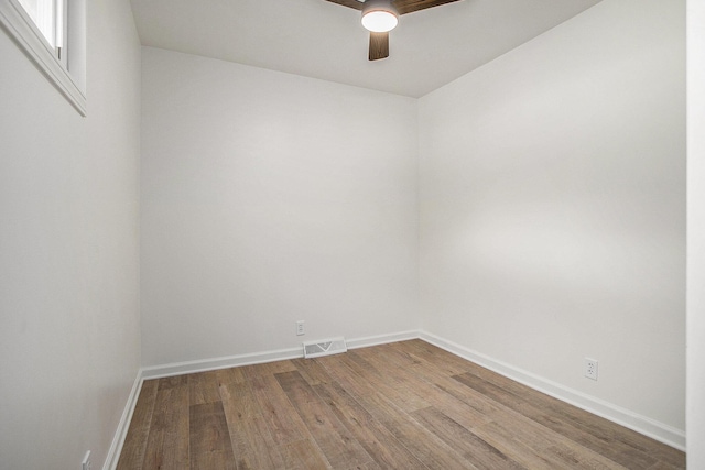 329 N Liberty St, Marshall, MI 49068 - spare room with wood finished floors, ceiling fan, and baseboards