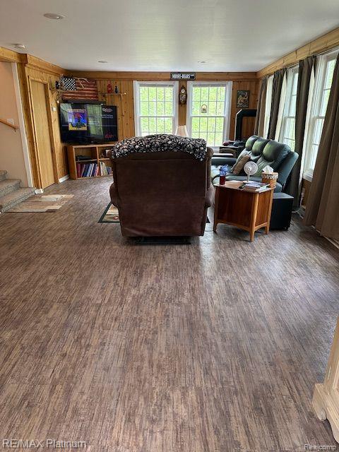 3624 Windy Hollow Rd NW, Rapid City, MI 49676 - living room featuring wood finished floors and stairs