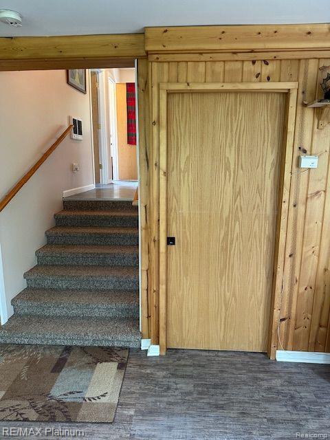 3624 Windy Hollow Rd NW, Rapid City, MI 49676 - stairs with wood finished floors