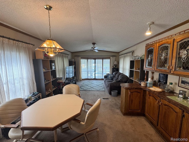 32 3rd St, Dearborn Heights, MI 48127 - dining space featuring a textured ceiling, crown molding, light carpet, a chandelier, and lofted ceiling
