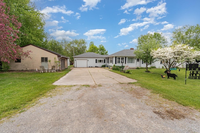 2430 S 4 Mile Rd, Kawkawlin, MI 48631 - single story home with driveway, a front yard, a garage, and a chimney