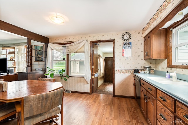 2430 S 4 Mile Rd, Kawkawlin, MI 48631 - dining space featuring wallpapered walls, light wood-style floors, and baseboards