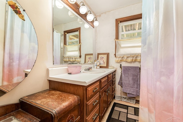 2430 S 4 Mile Rd, Kawkawlin, MI 48631 - bathroom with vanity and plenty of natural light