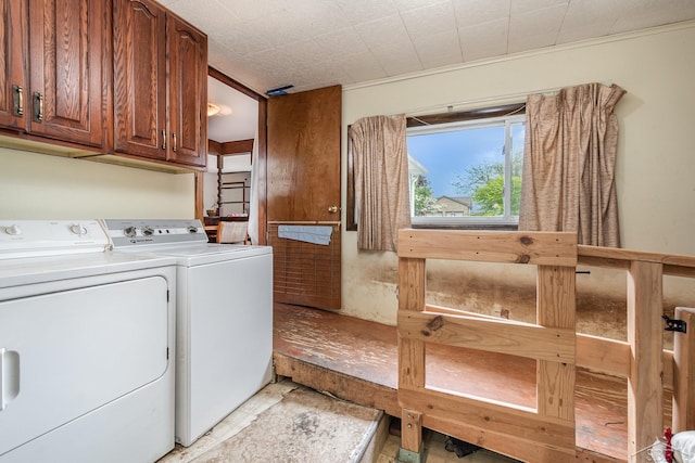 2430 S 4 Mile Rd, Kawkawlin, MI 48631 - washroom featuring washer and clothes dryer and cabinet space
