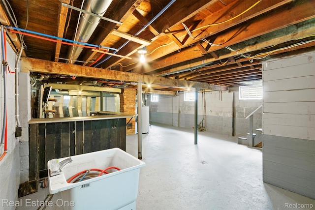 8492 Meadow Ave, Warren, MI 48089 - basement featuring water heater and a sink