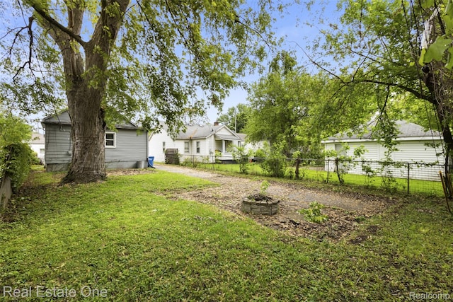 8492 Meadow Ave, Warren, MI 48089 - view of yard with an outdoor fire pit