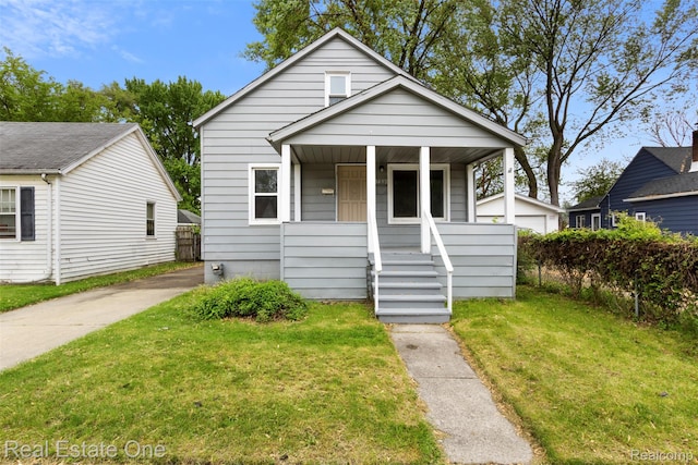 8492 Meadow Ave, Warren, MI 48089 - view of front of home with a porch and a front lawn