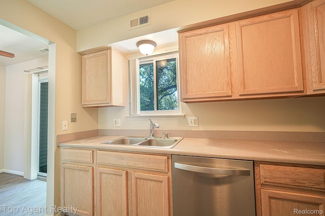 1676 Clemens Cir, Rochester Hills, MI 48307 - kitchen with stainless steel dishwasher, a sink, light brown cabinets, wood finished floors, and light countertops
