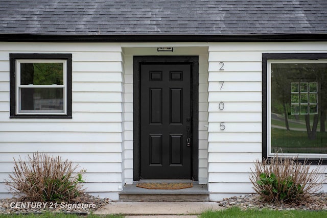2705 Mccarty Rd, Saginaw, MI 48603 - doorway to property featuring roof with shingles