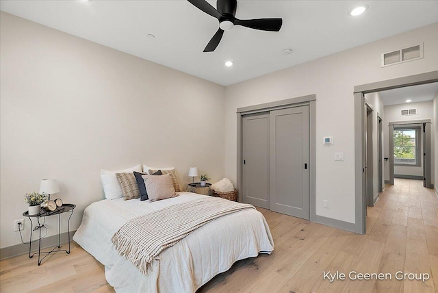 52 E 8th St Ste 210, Holland, MI 49423 - bedroom featuring light wood finished floors, recessed lighting, baseboards, a closet, and a ceiling fan