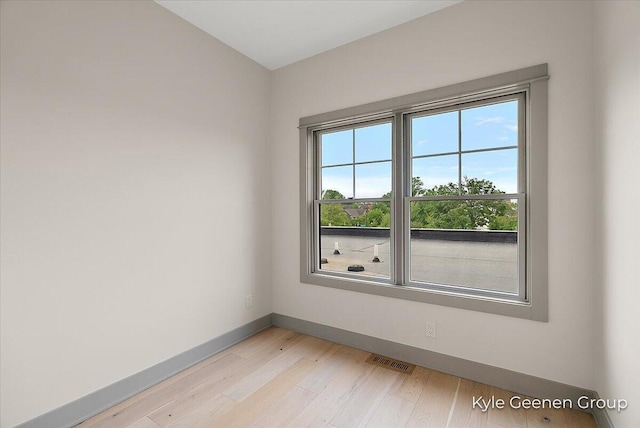 52 E 8th St Ste 210, Holland, MI 49423 - spare room with baseboards and light wood-style flooring