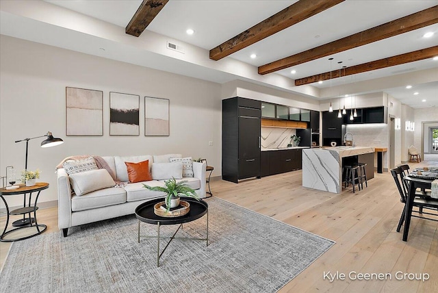52 E 8th St Ste 210, Holland, MI 49423 - living area featuring light wood-type flooring, beamed ceiling, and recessed lighting