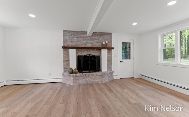5203 Nestrom Rd, Whitehall, MI 49461 - unfurnished living room featuring wood finished floors, a brick fireplace, baseboard heating, and beamed ceiling