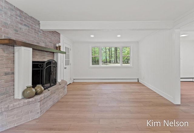 5203 Nestrom Rd, Whitehall, MI 49461 - unfurnished living room with a baseboard radiator, light wood-type flooring, a fireplace, crown molding, and beam ceiling