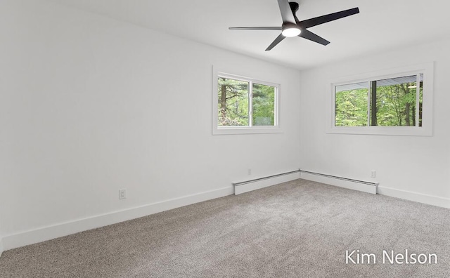 5203 Nestrom Rd, Whitehall, MI 49461 - carpeted empty room featuring healthy amount of natural light, a ceiling fan, and baseboards