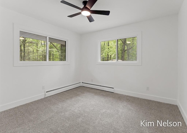 5203 Nestrom Rd, Whitehall, MI 49461 - carpeted empty room with plenty of natural light, a ceiling fan, and baseboards