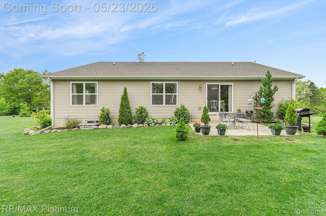 5956 Kerri Ln, Howell, MI 48855 - back of house with a lawn and a patio area