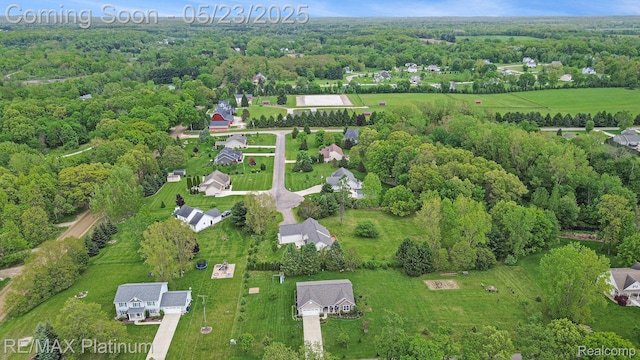 5956 Kerri Ln, Howell, MI 48855 - aerial view of property's location with a heavily wooded area