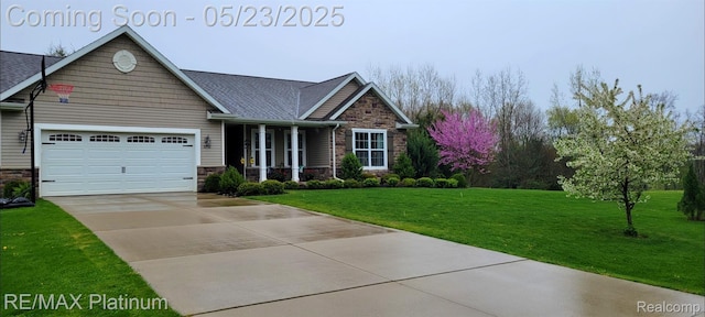5956 Kerri Ln, Howell, MI 48855 - craftsman house featuring stone siding, concrete driveway, a front lawn, and an attached garage