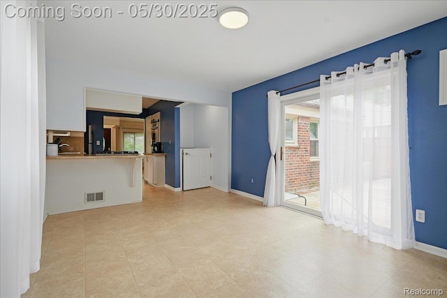 4412 Cooper Ave, Royal Oak, MI 48073 - unfurnished living room featuring baseboards