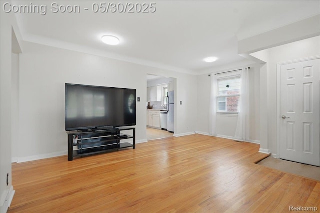 4412 Cooper Ave, Royal Oak, MI 48073 - living area featuring light wood-type flooring and baseboards