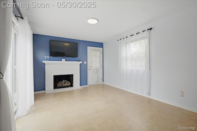 4412 Cooper Ave, Royal Oak, MI 48073 - unfurnished living room with a brick fireplace and baseboards