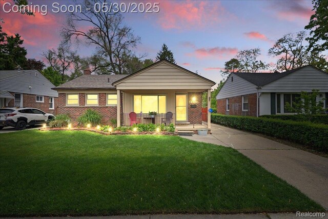 4412 Cooper Ave, Royal Oak, MI 48073 - view of front of property featuring brick siding, a front yard, and a chimney