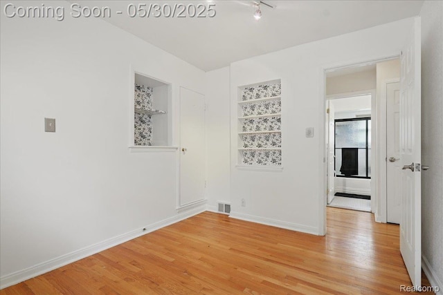 4412 Cooper Ave, Royal Oak, MI 48073 - unfurnished room with light wood-style floors and baseboards