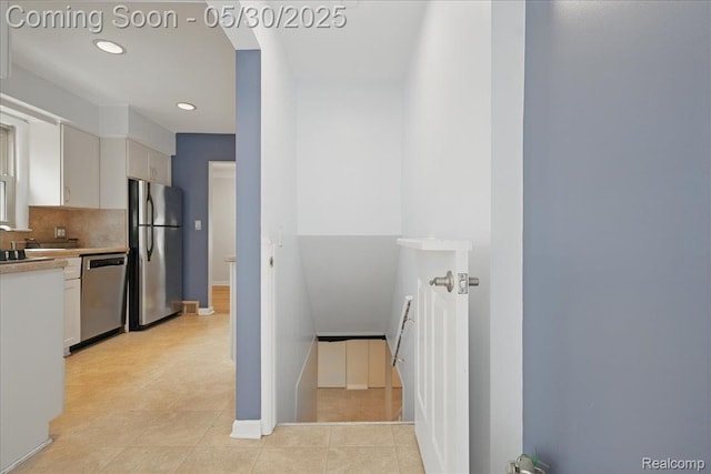 4412 Cooper Ave, Royal Oak, MI 48073 - kitchen featuring appliances with stainless steel finishes, white cabinets, recessed lighting, backsplash, and light countertops