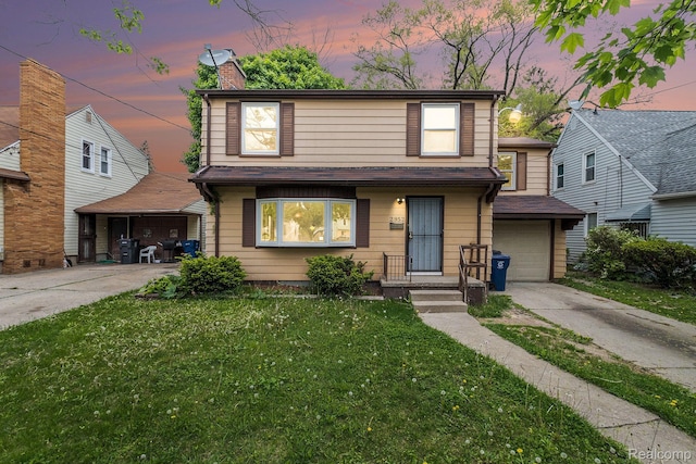 2952 Clement St, Flint, MI 48504 - traditional-style home with concrete driveway, a lawn, a garage, and a chimney