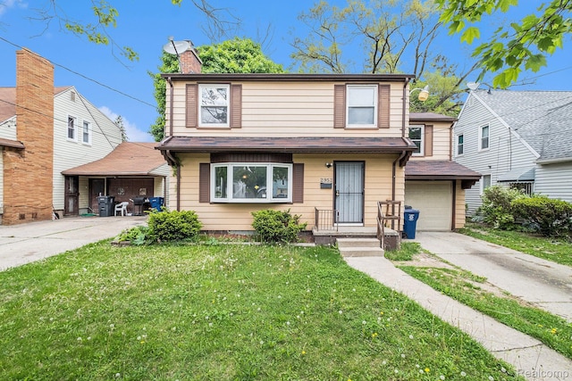 2952 Clement St, Flint, MI 48504 - traditional-style home featuring driveway, a front lawn, a garage, and a chimney