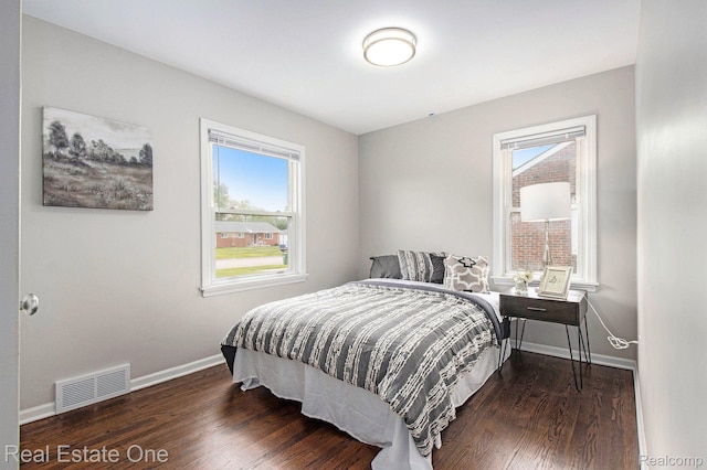 14620 Trenton Rd, Southgate, MI 48195 - bedroom featuring multiple windows, wood finished floors, and baseboards