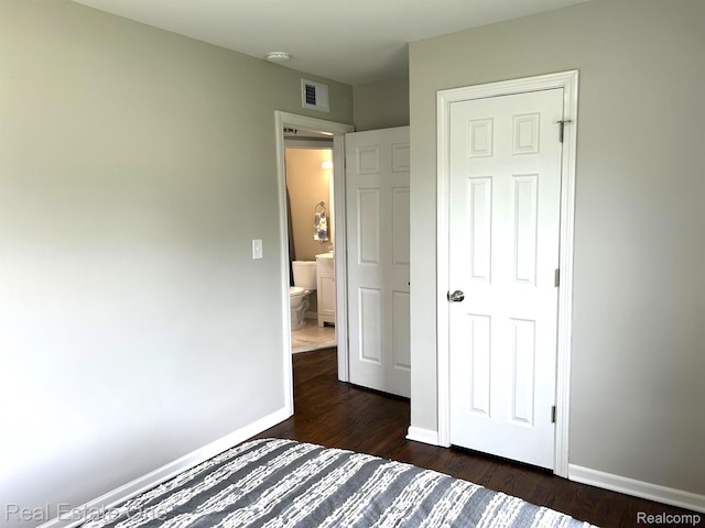14620 Trenton Rd, Southgate, MI 48195 - unfurnished bedroom with dark wood finished floors and baseboards