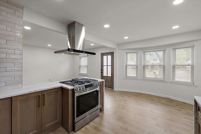 1437 Pearson St, Ferndale, MI 48220 - kitchen with stainless steel range with gas cooktop, island exhaust hood, light wood-type flooring, recessed lighting, and baseboards