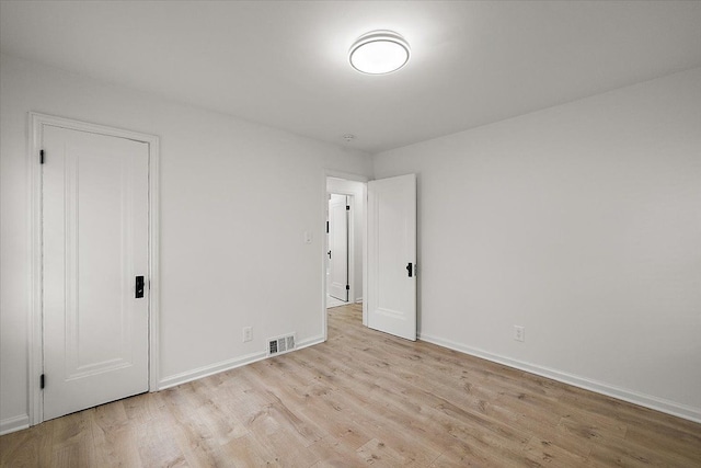 1437 Pearson St, Ferndale, MI 48220 - unfurnished bedroom featuring wood finished floors and baseboards