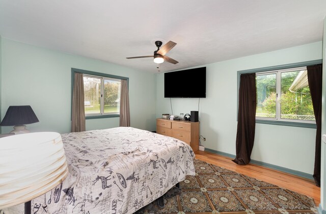 812 W Center, Alma, MI 48880 - bedroom featuring light wood-style floors, baseboards, and ceiling fan