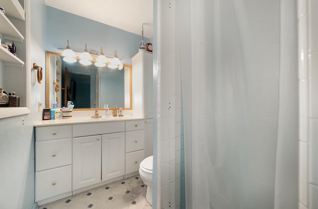 812 W Center, Alma, MI 48880 - bathroom featuring toilet, vanity, and a shower with curtain