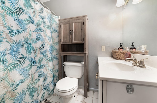 812 W Center, Alma, MI 48880 - bathroom with vanity, toilet, tile patterned floors, a shower with shower curtain, and baseboards