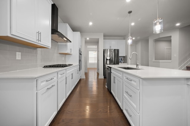 2610 Ironton Dr, Commerce Twp, MI 48382 - kitchen with a sink, wall chimney range hood, stainless steel appliances, backsplash, and light countertops