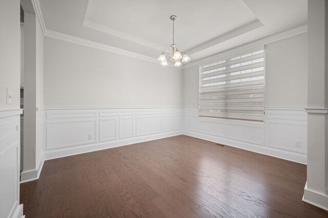 2610 Ironton Dr, Commerce Twp, MI 48382 - unfurnished room featuring a raised ceiling, a chandelier, dark wood-style floors, a wainscoted wall, and crown molding