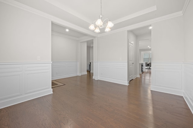 2610 Ironton Dr, Commerce Twp, MI 48382 - spare room with a chandelier, crown molding, dark wood-style floors, a wainscoted wall, and a decorative wall