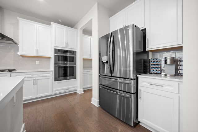 2610 Ironton Dr, Commerce Twp, MI 48382 - kitchen with appliances with stainless steel finishes, decorative backsplash, light countertops, and white cabinets