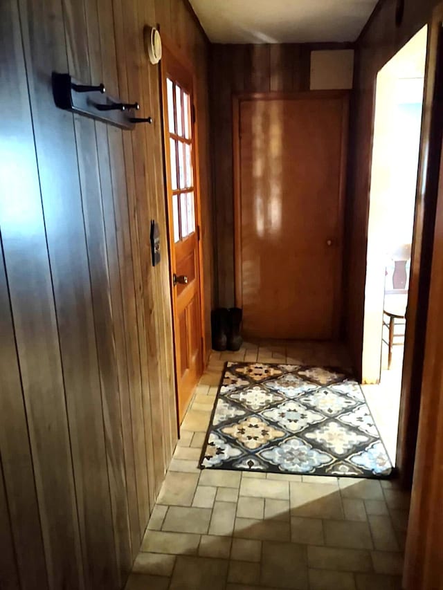 10122 Jones Rd, Bellevue, MI 49021 - entryway featuring wooden walls