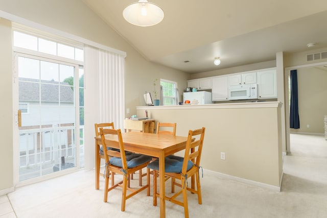 760 Olde English Cir, Howell, MI 48855 - dining room featuring vaulted ceiling, light carpet, and baseboards