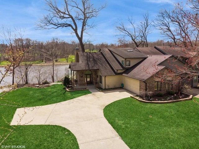 2942 White Oaks Ln, Buchanan, MI 49107 - view of front of house with concrete driveway, an attached garage, a front lawn, covered porch, and brick siding