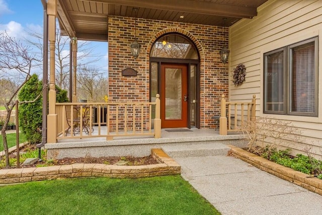 2942 White Oaks Ln, Buchanan, MI 49107 - doorway to property with brick siding and covered porch
