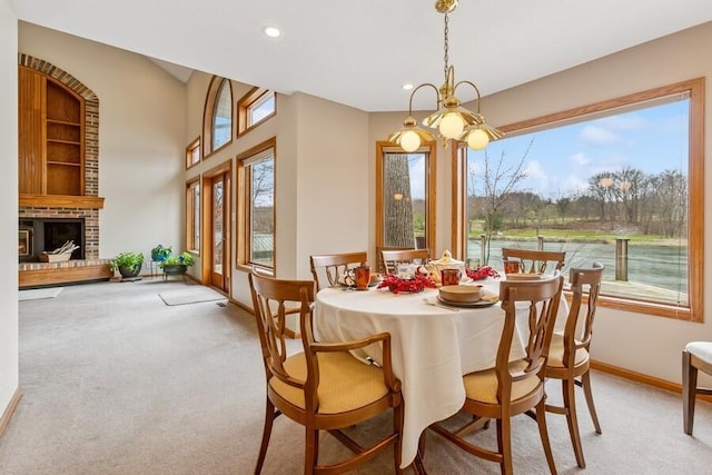 2942 White Oaks Ln, Buchanan, MI 49107 - carpeted dining area featuring baseboards, recessed lighting, and a brick fireplace