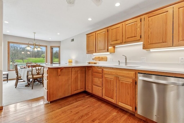 2942 White Oaks Ln, Buchanan, MI 49107 - kitchen featuring dishwasher, a sink, a peninsula, light countertops, and recessed lighting