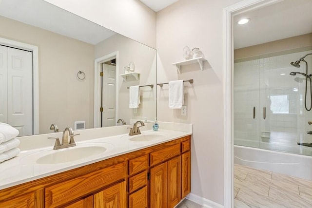 2942 White Oaks Ln, Buchanan, MI 49107 - bathroom with double vanity, combined bath / shower with glass door, and recessed lighting